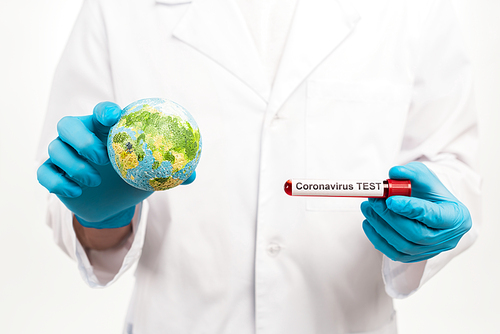 scientist holding small globe and sample with coronavirus test lettering isolated on white