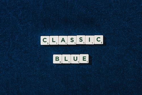 top view of classic blue lettering on cubes on blue velour background