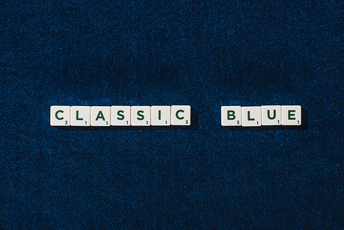 top view of classic blue lettering on cubes on blue velour background