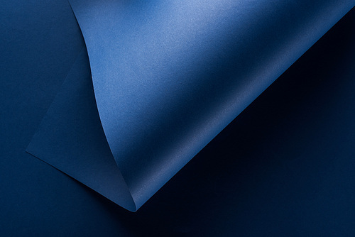 top view of curved blue paper background