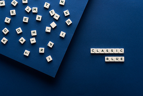top view of classic blue lettering on cubes on blue background