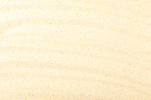 top view of beach with yellow textured sand and copy space