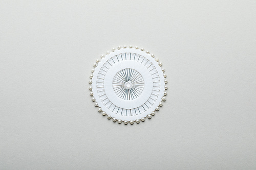 top view of sewing pins in round container isolated on grey