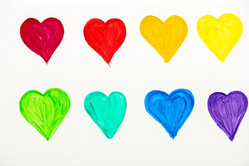 painted and colorful hearts isolated on white