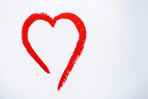 red drawn heart isolated on white with copy space