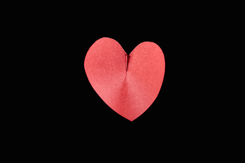 Top view of red paper in heart shape isolated on black