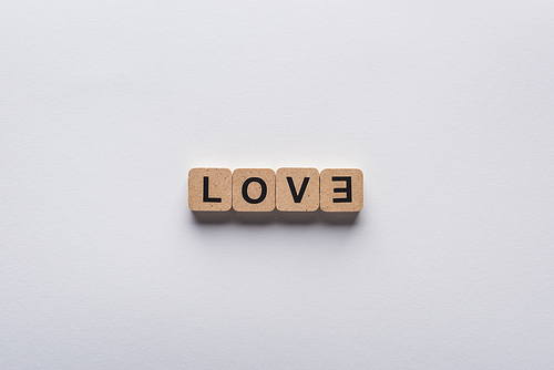 top view of cubes with love lettering on white background