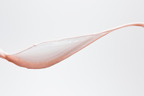 smooth fresh pink milk splash isolated on white