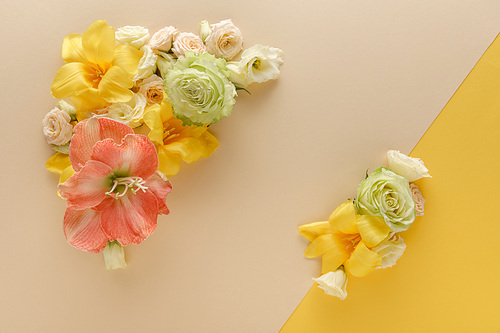 top view of spring floral bouquets on beige and yellow background