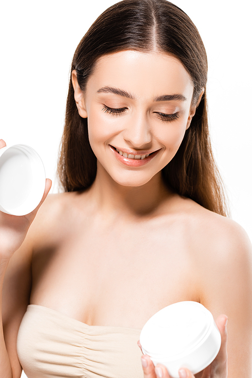 happy young woman with perfect skin holding cosmetic cream isolated on white