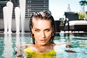 beautiful sexy woman  in swimming pool on resort