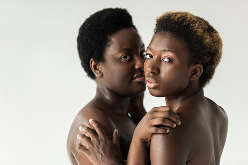 nude african american women hugging isolated on grey