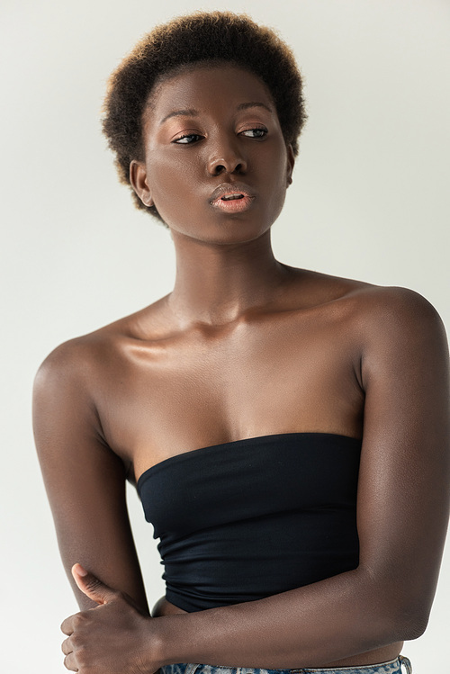 african american girl in black top isolated on grey