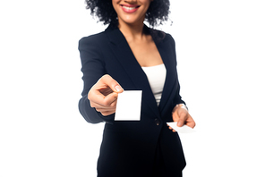 Cropped view of african american businesswoman smiling and presenting business card isolated on white