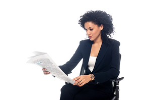 African american businesswoman in office chair reading newspaper isolated on white
