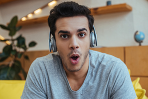 Shocked man in headphones 