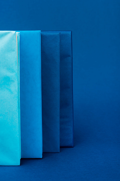 bright books on blue background with copy space
