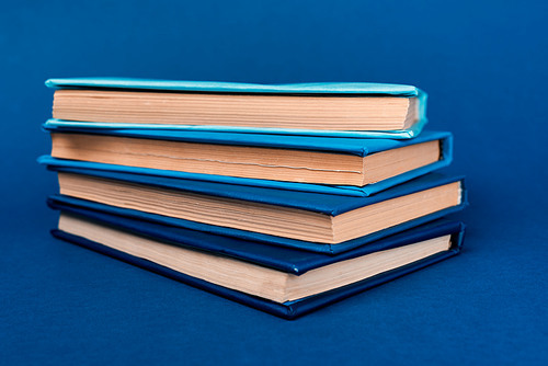 bright and colorful books on blue background