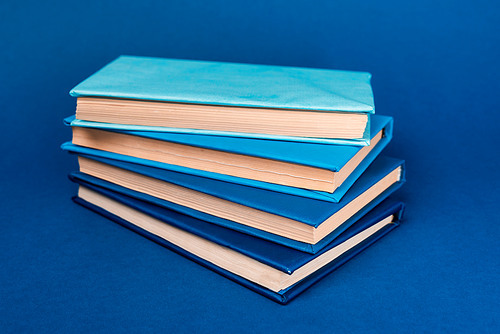 bright books with copy space on blue background