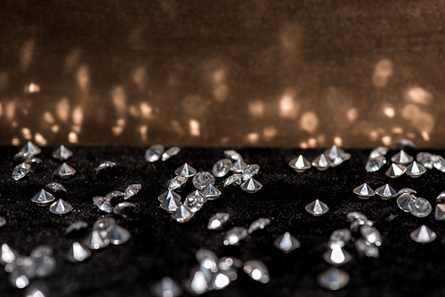 Selective focus of gemstones on velvet surface with reflection