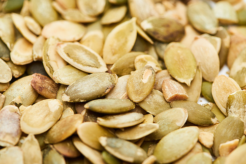 close up view of tasty organic pumpkin seeds