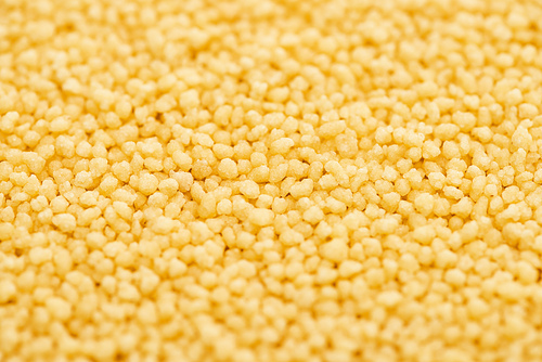 close up view of raw organic couscous groat
