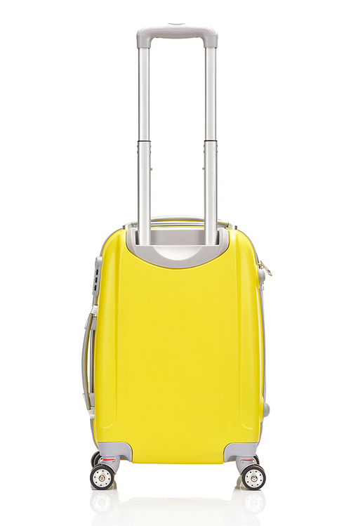 back view of yellow plastic wheeled colorful suitcase with handle isolated on white