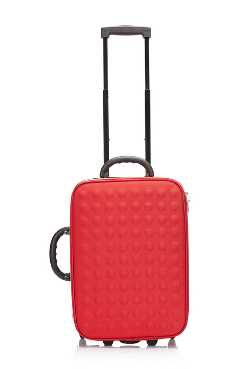 red textured suitcase with handle on wheels isolated on white