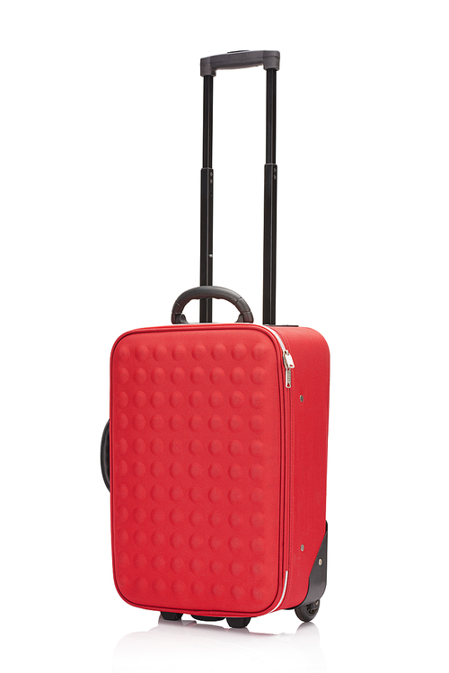 red wheeled colorful suitcase with handle isolated on white