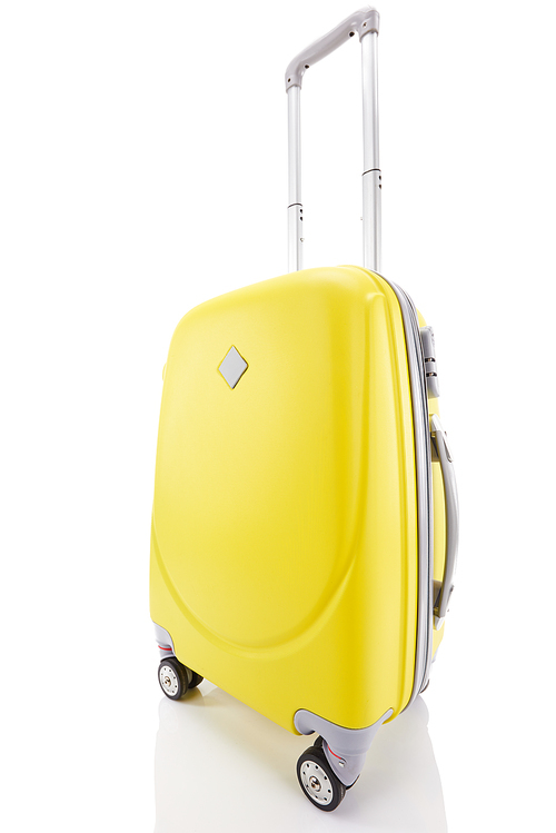 yellow plastic wheeled colorful suitcase with handle isolated on white