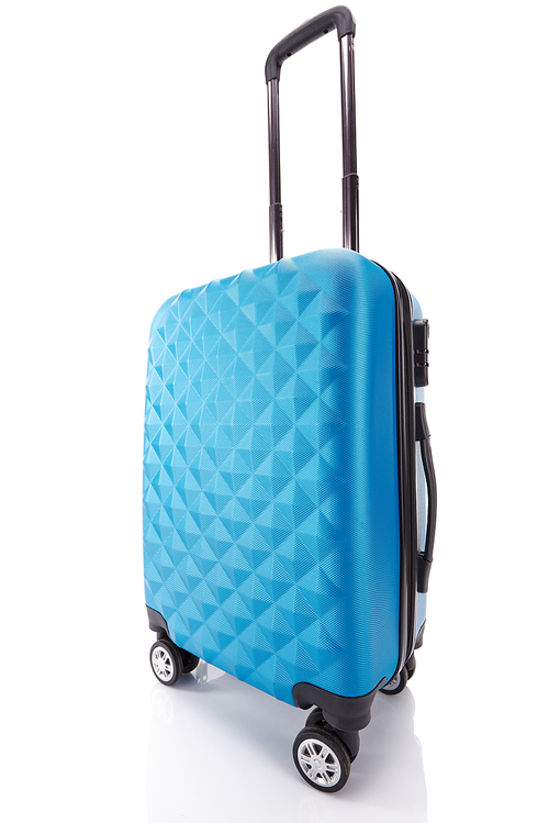 blue textured wheeled travel bag with handle isolated on white