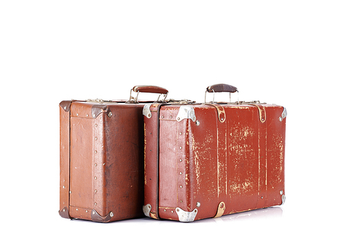two leather brown aged retro suitcases isolated on white