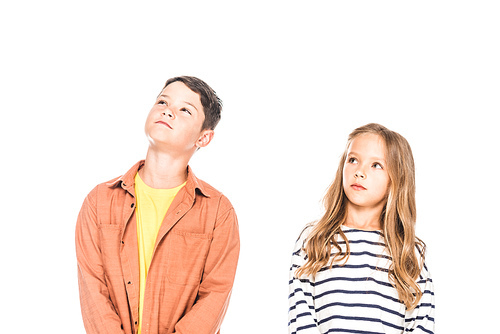 two pensive kids looking up isolated on white