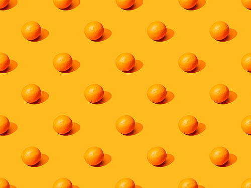 ripe oranges on colorful background, seamless pattern