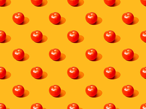 fresh tomatoes on orange colorful background, seamless pattern