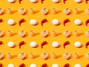 fresh white chicken eggs, pasta and chili peppers on orange colorful background, seamless pattern
