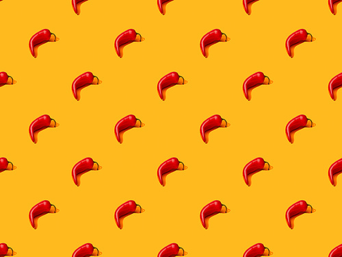 red spicy chili peppers on orange colorful background, seamless pattern