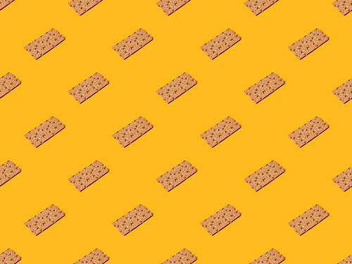 fresh crispbread on orange colorful background, seamless pattern