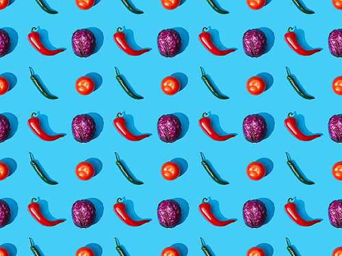top view of whole ripe cabbage, tomatoes and peppers on blue background, seamless pattern