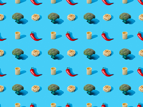 fresh pasta with broccoli and chili peppers on blue background, seamless pattern