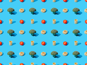 fresh pasta with broccoli and tomatoes on blue background, seamless pattern
