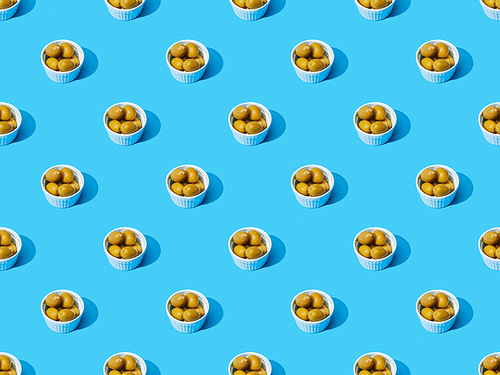 olives in bowls on blue colorful background, seamless pattern