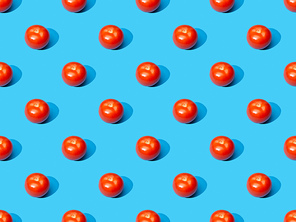 fresh tomatoes on blue colorful background, seamless pattern