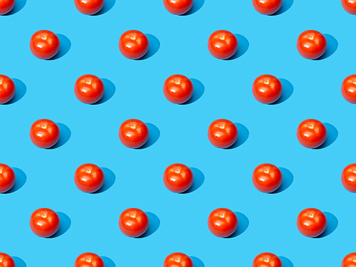 fresh tomatoes on blue colorful background, seamless pattern