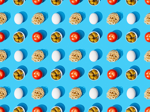 top view of fresh pasta with olives, tomatoes and eggs on blue background, seamless pattern