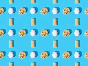 top view of fresh pasta with eggs on blue background, seamless pattern