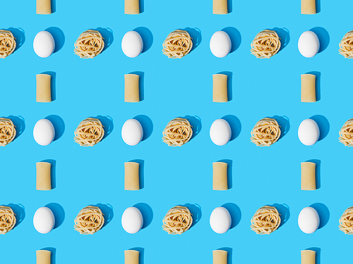 top view of fresh pasta with eggs on blue background, seamless pattern