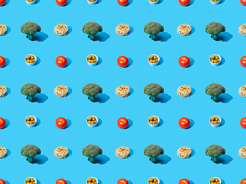 fresh pasta with broccoli, olives and tomatoes on blue background, seamless pattern