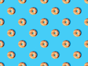 top view of fresh buns on blue background, seamless pattern