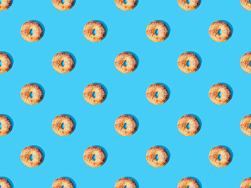 top view of fresh buns on blue background, seamless pattern